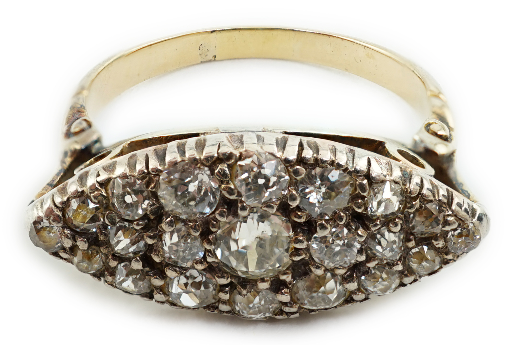 An early 20th century gold and diamond cluster set navette shaped ring